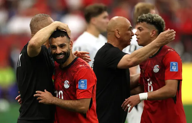 Mohamed Salah #10 and Emam Ashour #8 of Egypt celebrate with coaches as they are substituted during the FIFA World Cup 2026 Group G match between New Zealand and Egypt