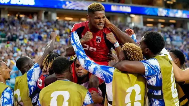 Cape Verde's Helio Varela celebrates with team-mates after scoring an equaliser against Uruguay