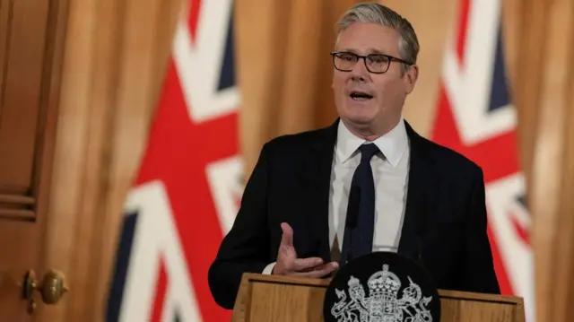 Starmer behind lectern