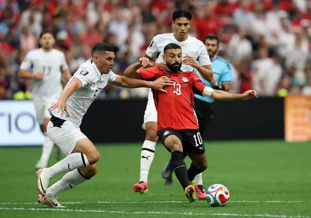 Mohamed Salah #10 of Egypt is challenged by Michael Boxall #5 of New Zealand during the FIFA World Cup 2026 Group G match between New Zealand and Egypt