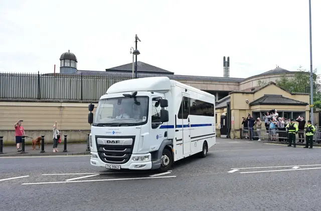 A white prison van leaving Newry court