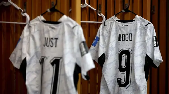 Just and Wood New Zealand shirts hang in the dressing room