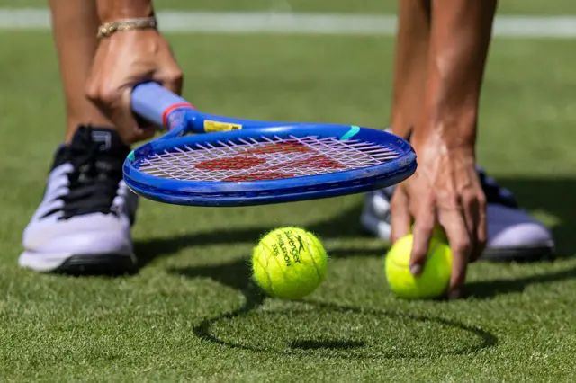 Slazenger 2026 Wimbledon tennis ball is seen on grass court
