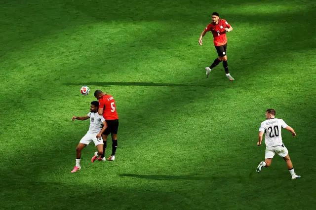 Ramy Rabia #5 of Egypt competes for a header against Sarpreet Singh #10 of New Zealand during the FIFA World Cup 2026 Group G match between New Zealand and Egypt