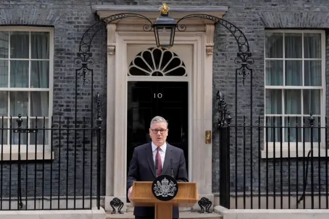 Keir Starmer stands at a lectern outside Downing Street