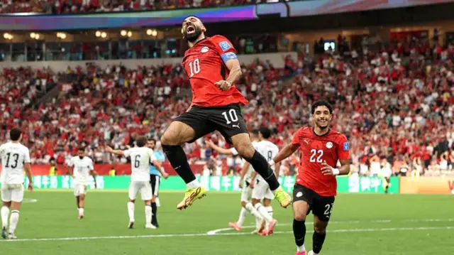 Mo Salah leaps into the air after his goal