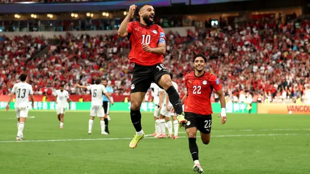 Mohamed Salah celebrates scoring in Egypt's 3-1 win over New Zealand