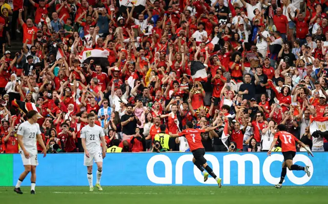Trezeguet #7 of Egypt celebrates scoring his team's third goal during the FIFA World Cup 2026 Group G match between New Zealand and Egypt