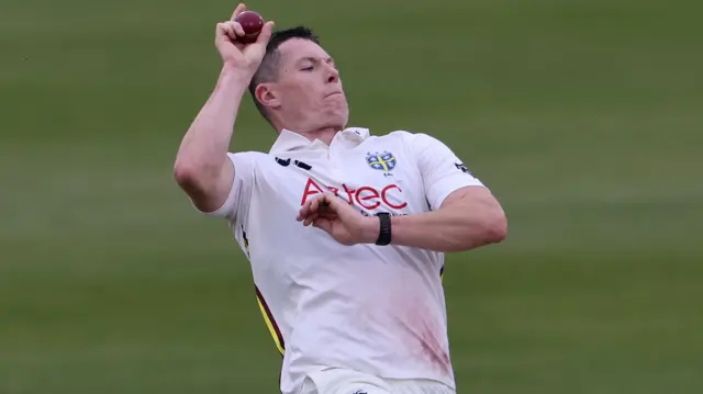 Matt Potts bowling for Durham