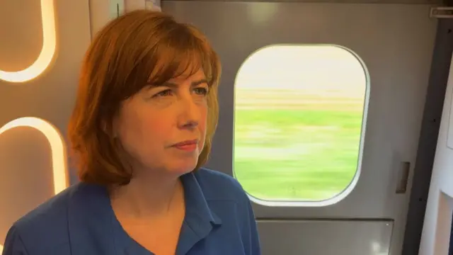 Lucy Powell speaking from the train