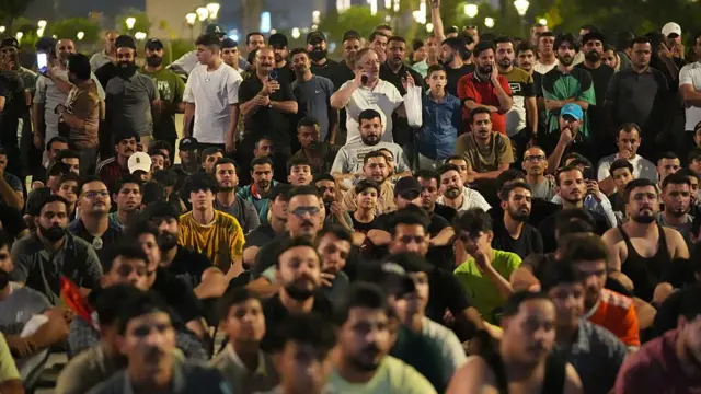 Iraqi football fans gather to watch the 2026 FIFA World Cup Group I match between Iraq and France on a giant screen in Baghdad, Iraq, on June 23, 2026. Supporters gather in the capital to follow the national team's World Cup campaign and cheer on Iraq during the tournament.