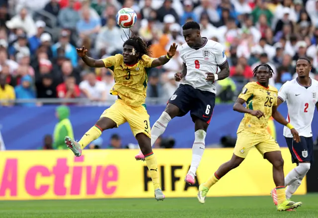 Marc Guehi of England wins a header under pressure