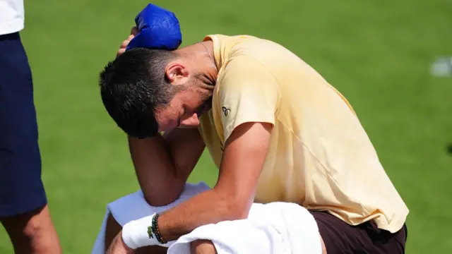 Novak Djokovic cools off with an ice pack in London during practice for the Wimbledon championships, which start on Monday