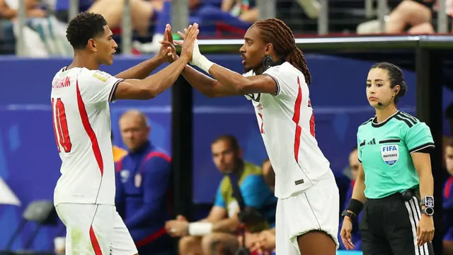 : Jude Bellingham #10 of England is substituted for teammate Djed Spence #25 during the FIFA World Cup 2026 Group L match between England and Croatia at Dallas Stadium on June 17, 2026 in Arlington, Texas.