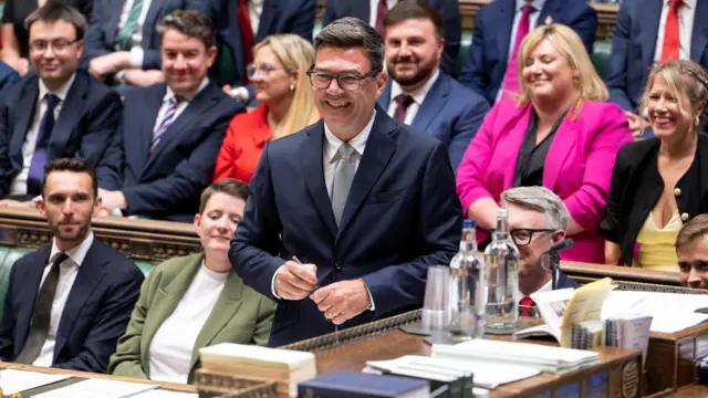 Andy Burnham smiles in the House of Commons
