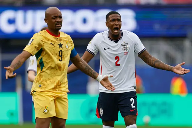 : Jordan Ayew of Ghana and Ezri Konsa of England react