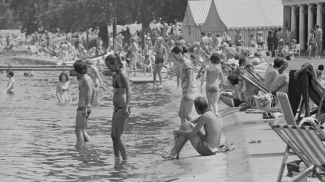 Londoners relaxing on a summer day near The Serpentine in Hyde Park, London, UK, 25th June 1976