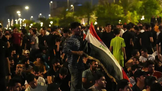 Iraqi football fans gather to watch the 2026 FIFA World Cup Group I match between Iraq and France on a giant screen in Baghdad, Iraq, on June 23, 2026. Supporters gather in the capital to follow the national team's World Cup campaign and cheer on Iraq during the tournament.