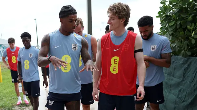 Marcus Rashford and Anthony Gordon of England interact as they walk out for a training session on June 03, 2026 in West Palm Beach, Florida