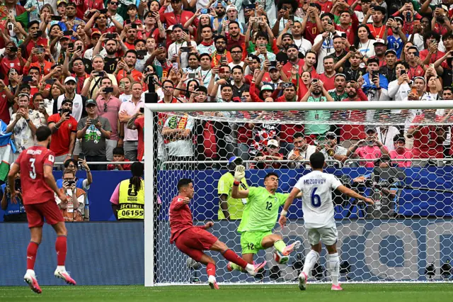Portugal's forward #07 Cristiano Ronaldo (L) shoots to goal