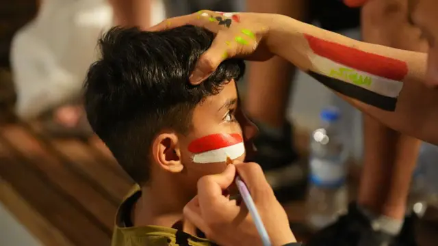 raqi football fans gather to watch the 2026 FIFA World Cup Group I match between Iraq and France on a giant screen in Baghdad, Iraq, on June 23, 2026. Supporters gather in the capital to follow the national team's World Cup campaign and cheer on Iraq during the tournamen