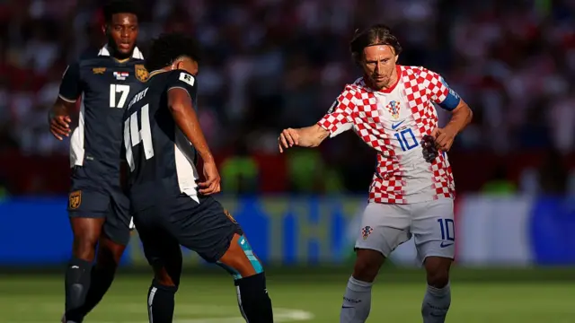 Luka Modric of Croatia controls the ball under pressure from Jose Fajardo and Carlos Harvey #14 of Panama during the FIFA World Cup 2026 Group L match between Panama and Croatia.