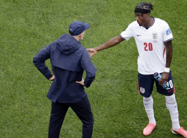 England manager Thomas Tuchel gives instructions to Noni Madueke