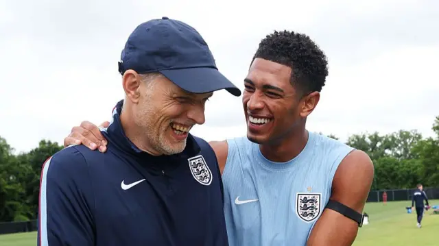 Thomas Tuchel, Manager of England, reacts with Jude Bellingham #10 of England during an England Training Session during an England FIFA World Cup 2026 Camp on June 22, 2026 in Kansas City, Kansas.