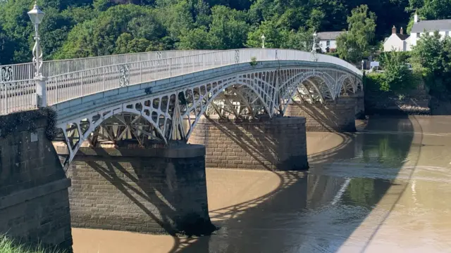 An image of Chepstow's Old Wye Bridge, an 106m long cast iron and stone bridge from 1816