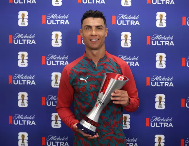 Cristiano Ronaldo #7 of Portugal poses for a photograph with the Superior Player of the Match award