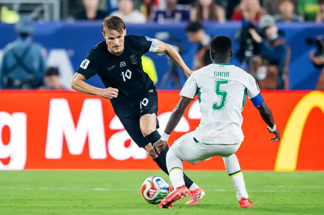 Martin Odegaard of Norway, Idrissa Gueye of Senegal during the World Cup match between Norway v Senegal at the New York/New Jersey Stadium
