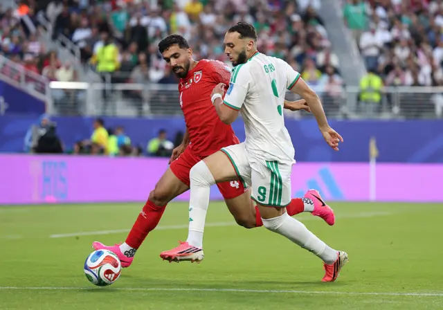 Husam Abudahab #4 of Jordan competes for the ball against Amine Gouiri #9 of Algeria during the FIFA World Cup 2026 Group J match between Jordan and Algeria