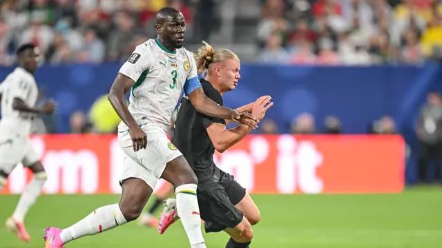 Kalidou Koulibaly of Senegal and Erling Haaland of Norway battle for the ball during the FIFA World Cup 2026 Group I match between Norway and Senegal