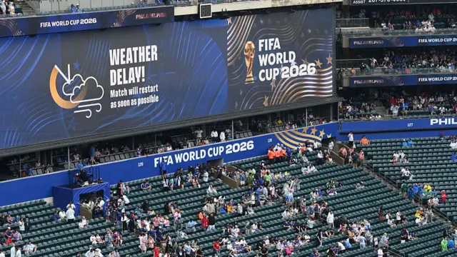 Fans in the stands during a weather delay