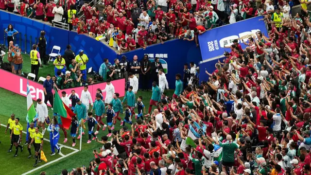 Portgual and Uzbekistan players walk out