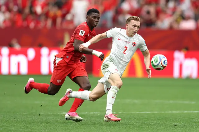 Alistair Johnston #2 of Canada controls the ball