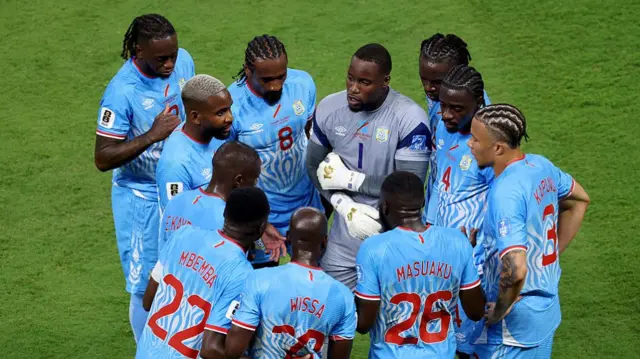 Congo DR players huddle during a hydration break in the FIFA World Cup 2026 Group K match between Colombia and Congo DR.