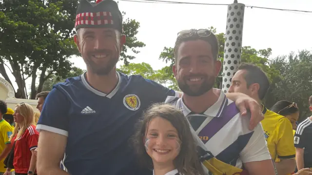 Two men and a child