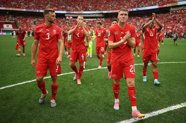 Wilvan Widmer #3 and Michel Aebischer #20 of Switzerland applaud fans
