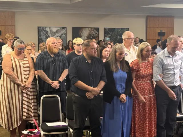 Families stand