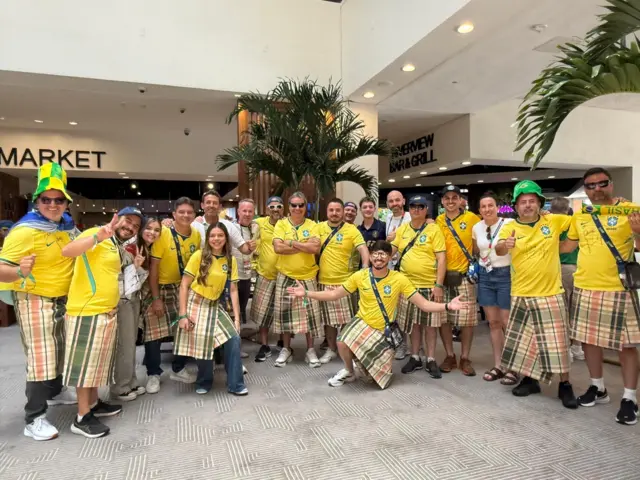 BBC Scotland pundits surrounded by kilt wearing Brazilian fans