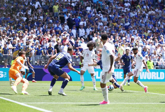 Hassan Alhaydos #10 of Qatar scores his team's first goal