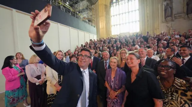 Andy Burnham with colleagues from the Parliamentary Labour Party in Westminster Hall at the Houses of Parliament in central London, as he returns to the House of Commons to take up his seat after winning the Makerfield by-election.