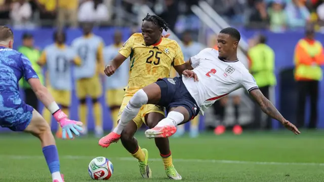 Ezri Konsa of England makes a last-ditch challenge on Prince Kwabena Adu of Ghana during the FIFA World Cup 2026 Group L match between England and Ghana at Boston Stadium on June 23, 2026 in Foxborough, Massachusetts.