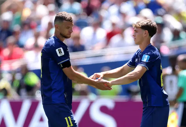 Edin Dzeko #11 of Bosnia and Herzegovina reacts with Ermin Mahmic