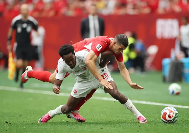 Remo Freuler #8 of Switzerland and Ali Ahmed
