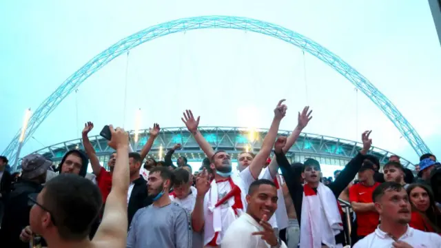 England fans gather outside of the stadium during the UEFA Euro 2020 Championship Final between Italy and England at Wembley Stadium on July 11, 2021 in London, England.