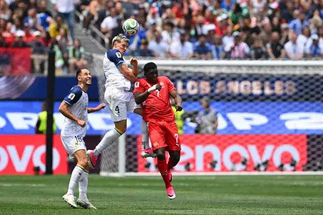 Tarik Muharemovic heads the ball