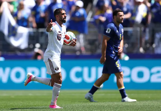 Hassan Alhaydos #10 of Qatar celebrates