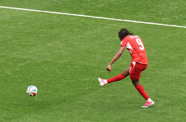 Johan Manzambi #9 of Switzerland scores